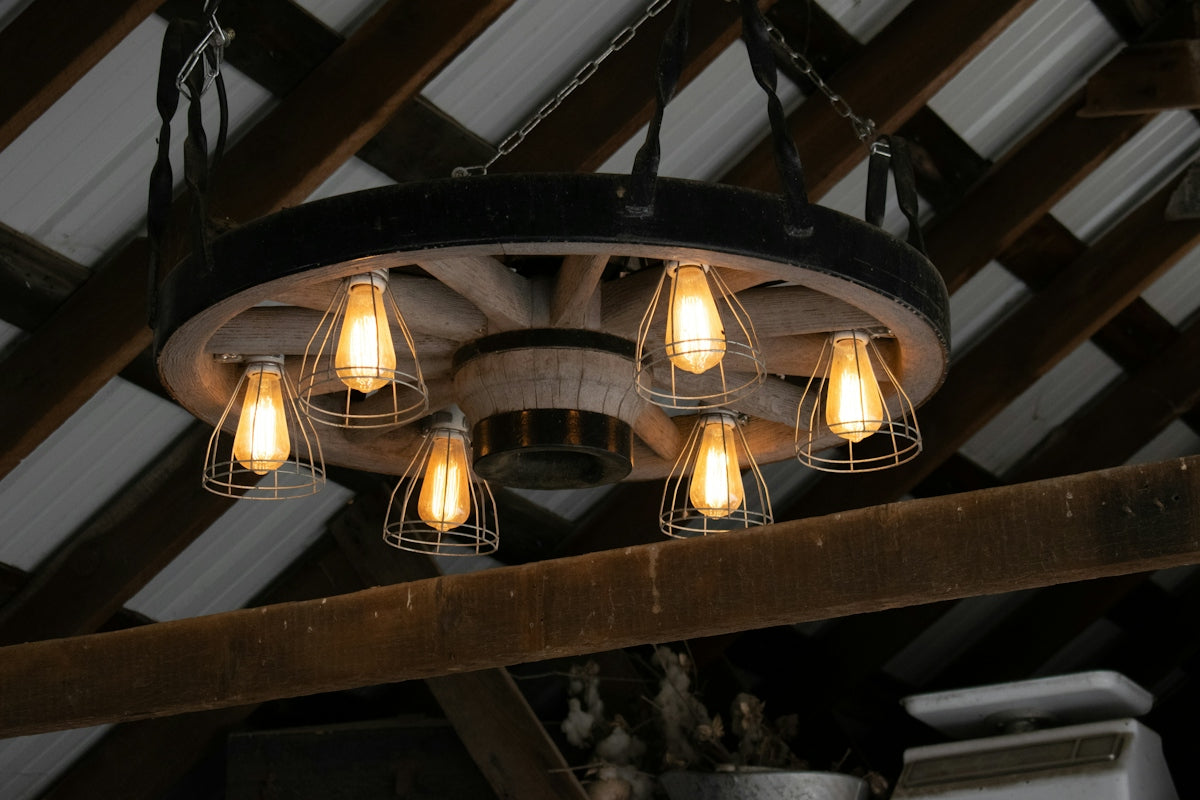 A wagon wheel chandelier hangs from the ceiling